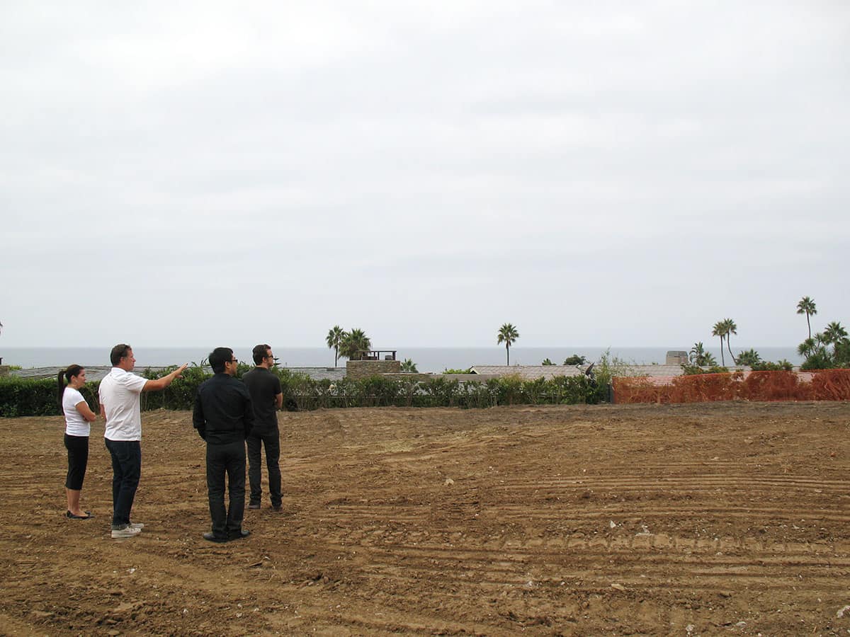 EYRC team evaluating plot with clients